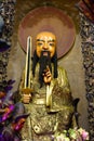 Fierce Statue with sword and golden coat in Asian Buddhist Temple Jade Emperor Pagoda, Ho-Chi-Minh City, Vietnam.