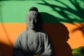 The Statue of Budha and its shadow on a warm morning