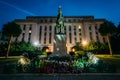 Statue and building at the State Capitol at night in Columbia, S