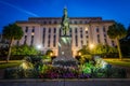 Statue and building at the State Capitol at night in Columbia, S