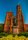 Statue and bushes in front of the Smithsonian Castle, in Washington DC Royalty Free Stock Photo