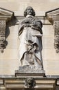 Statue of Cardinal Mazarin on facade of the Louvre palace on the northern side of Cour Napoleon, Louvre, Paris