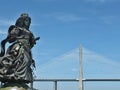 Statue of Catherine of Braganza with Vasco da Gama bridge , Lisbon - Portugal Royalty Free Stock Photo