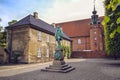 The statue of Chancellor Peder Griffenfeld and a tower in Copenhagen