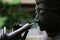 Statue of a Character in Thai Famous Literature Blowing Flute is