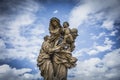 statue on the Charles Bridge in Prague and pigeons Royalty Free Stock Photo