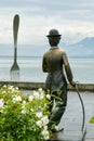 Statue of Charles Chaplin and Fork of Vevey in Lake Geneva in Vevey, Switzerland