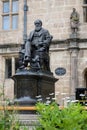 Statue of Charles Darwin outside former Shrewsbury school and current library Royalty Free Stock Photo