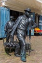 Statue of cheese carriers at the cheese market in Edam