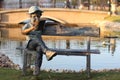 Children statue reading a book