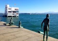 View of a statue tu Los Raqueros on waterfront in Santander, Spain
