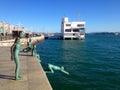 View of a statue tu Los Raqueros on waterfront in Santander, Spain