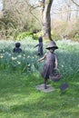 A statue of children playing in the gardens of Le Manoir aux Quat Saisons in Oxfordshire in the UK Royalty Free Stock Photo