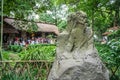 Statue of Chinese Poet Dufu and Du Fu Thatched Cottage in background in Chengdu China