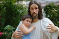 Statue of Christ and Child In Hug. Royalty Free Stock Photo