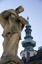 Statue with church spire Royalty Free Stock Photo
