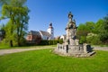 Statue and church in Tyniec nad Sleza, Poland