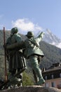 Statue of climbers Horace-Benedict de Saussure and Jacques Balmat R pointing to Mont Blanc in Chamonix, French Alps, France Royalty Free Stock Photo