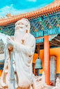 Statue of Confucius, the great Chinese philosopher in Temple of Confucius at Beijing.Focus on the background Royalty Free Stock Photo