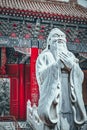 Statue of Confucius, the great Chinese philosopher in Temple of Confucius at Beijing.Focus on the background Royalty Free Stock Photo
