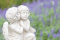 Statue of couple cupid in the garden. Royalty Free Stock Photo