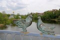 Statue of couple of pigeons on the Kyiv bridge railing in Vinnytsia, Ukraine