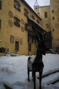 Statue in courtyard of the castle of bruneck during a snowfall