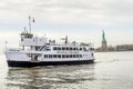 Statue Cruises Ferry Boat with Tourists and Visitors with Statue of Liberty in Background. New York City, USA Royalty Free Stock Photo