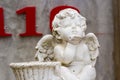 Statue of cupid in garden Royalty Free Stock Photo