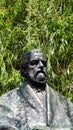 The Statue of Czech Composer Bedrich Smetana by his beloved River Vltava in front of his Museum in Prague in Czech Republic