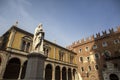 Statue of Dante Alighieri in Piazza dei Signori, Verona, Italy. Beautiful statues of Dante in the middle of Verona old town with Royalty Free Stock Photo