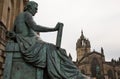 Statue of David Hume with St Gile`s Cathedral in the background, Edinburgh Royalty Free Stock Photo