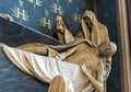 A statue of Death in a cape standing over a deceased person in an opened coffin, Notre-Dame de Paris cathedral, Paris Royalty Free Stock Photo