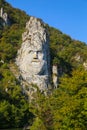 The statue of Decebal carved in the mountain. Decebal`s head carved in rock, Iron Gates Natural Park Royalty Free Stock Photo