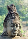 Statue of a demon on the causeway to Angkor Thom`s south gate