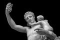 Statue of Dionysus or Bacchus with bunch of grapes isolated on black Royalty Free Stock Photo