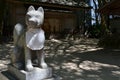 The statue of a dog at a Japanese shrine in Fukuoka. Pic was taken in August 2017 Royalty Free Stock Photo