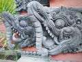 statue of a dragon head with an open mouth