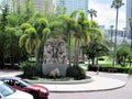 Statue amid palm trees outside University of Tampa