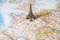 Statue of Eiffel Tower on a map Royalty Free Stock Photo