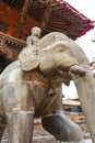 Statue of an elephant with a man in front of a temple, Durbar Square, Lalitpur Patan in Nepal