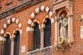 Statue on the facade House of Merchants in Verona, Italy