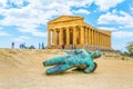 Statue of fallen Icaro in front of the Concordia temple in the Valley of temples near Agrigento in Sicily, Italy Royalty Free Stock Photo