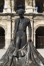 Statue of famous bullfighter in front of the arena in Nimes, France Royalty Free Stock Photo