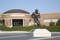 Statue of famous football player in front of university building