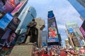 The statue of Father Duffy with street signs in Times Square, New York City