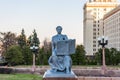 A statue of a female student with a book next to the entrance to the main building of Moscow State University, MSU. Named after