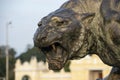 A statue of a ferocious tiger made of bronze