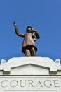 Statue of a Fireman Holding Child