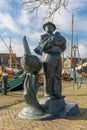 The statue the Fisherman by Hans Kuyper at the harbor of Spakenburg. The village has several harbors. Royalty Free Stock Photo